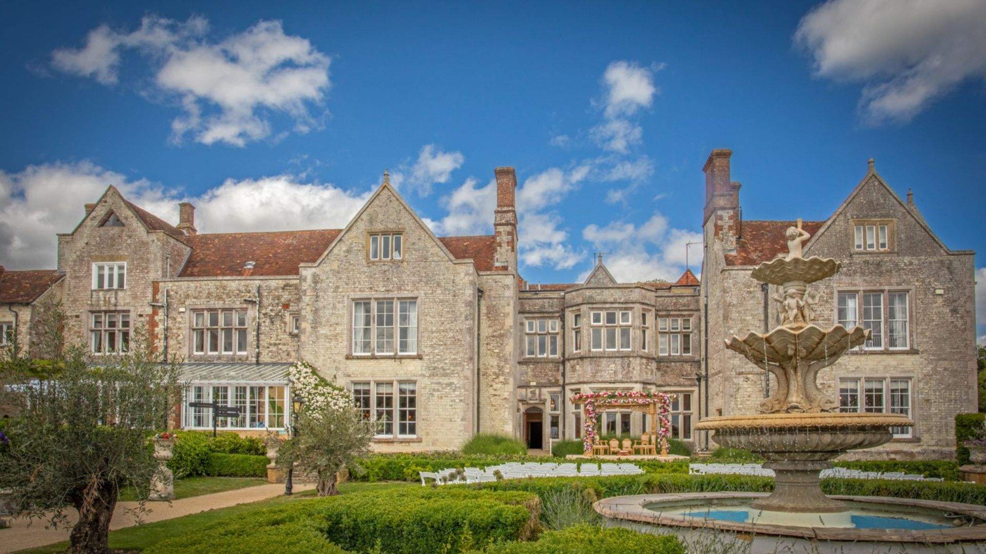 The historic Froyle Park manor and fountain in Hampshire